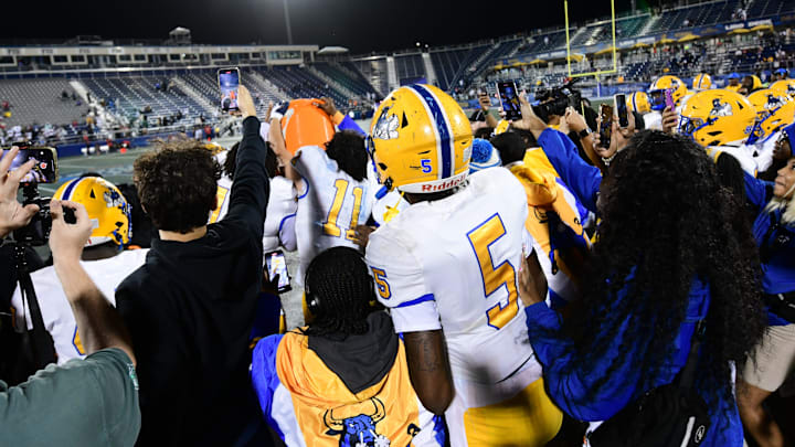 Miami Northwestern tried to surprise head coach Teddy Bridgewater with a Gatorade bath following the team's win over Raines in the Class 3A state championship at Florida International University on Dec. 14, 2024.