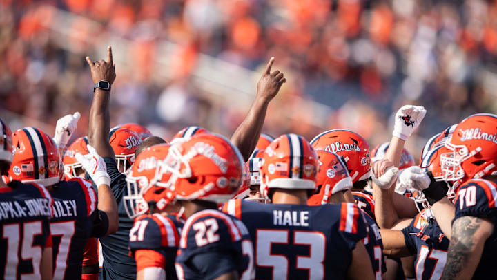 Dec 31, 2024; Orlando, FL, USA;  The Illinois Fighting Illini huddle up before the game against the South Carolina Gamecocks at Camping World Stadium. Mandatory Credit: Jeremy Reper-Imagn Images