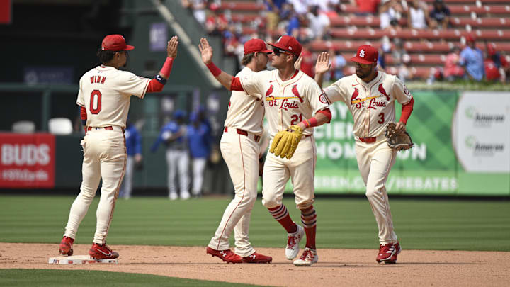 Jul 13, 2024; St. Louis, Missouri, USA; St. Louis Cardinals shortstop Masyn Winn (0), outfielder Lars Nootbaar (21), second baseman Nolan Gorman (16), and outfielder Dylan Carlson (3) celebrate defeating the Chicago Cubs after at Busch Stadium. Mandatory Credit: Jeff Le-Imagn Images