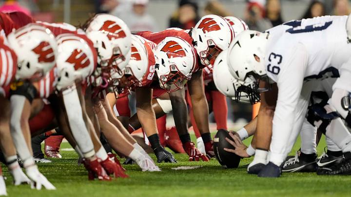 The Penn State Nittany Lions line up for a play during the game against the Wisconsin Badgers. The Penn State Nittany Lions line up for a play during the game against the Wisconsin Badgers.