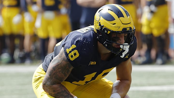 Sep 14, 2024; Ann Arbor, Michigan, USA; Michigan Wolverines tight end Colston Loveland (18) gets set against the Arkansas State Red Wolves at Michigan Stadium. Mandatory Credit: Rick Osentoski-Imagn Images Sep 14, 2024; Ann Arbor, Michigan, USA; Michigan Wolverines tight end Colston Loveland (18) gets set against the Arkansas State Red Wolves at Michigan Stadium. Mandatory Credit: Rick Osentoski-Imagn Images