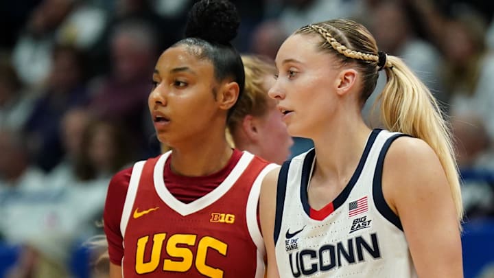 UConn Huskies guard Paige Bueckers (5) and USC Trojans guard JuJu Watkins (12) on the court in the first half at XL Center. UConn Huskies guard Paige Bueckers (5) and USC Trojans guard JuJu Watkins (12) on the court in the first half at XL Center.