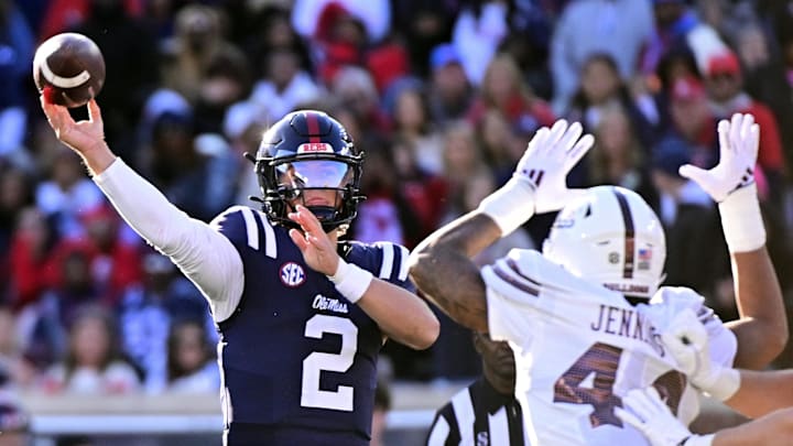 Mississippi Rebels quarterback Jaxson Dart (2) looks to pass while defended by Mississippi State Bulldogs linebacker Branden Jennings (44) during the first quarter at Vaught-Hemingway Stadium.