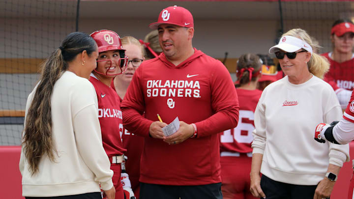 Oklahoma's coaches meet during a Kentucky mound visit at Love's Field.