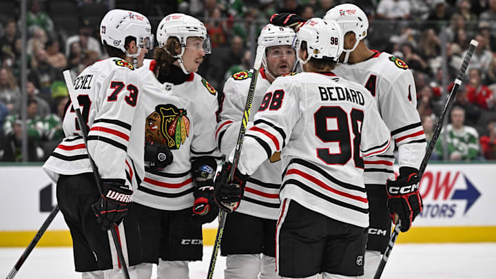 Nov 7, 2024; Dallas, Texas, USA; Chicago Blackhawks left wing Tyler Bertuzzi (59) and left wing Lukas Reichel (73) and center Connor Bedard (98) and center Ryan Donato (8) and defenseman Connor Murphy (5) celebrates a goal scored by Bertuzzi against the Dallas Stars during the third period at the American Airlines Center. Mandatory Credit: Jerome Miron-Imagn Images