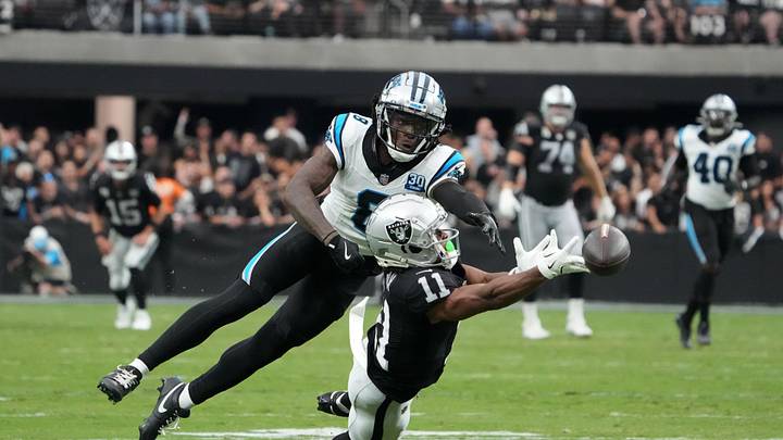 Sep 22, 2024; Paradise, Nevada, USA; Las Vegas Raiders wide receiver Tre Tucker (11) attempts to catch the ball against Carolina Panthers cornerback Jaycee Horn (8) in the second half at Allegiant Stadium. Mandatory Credit: Kirby Lee-Imagn Images