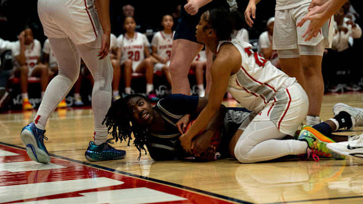 Kettering Fairmont guard Janiyah Hargrave (left) and Princeton guard Heaven Sneed.