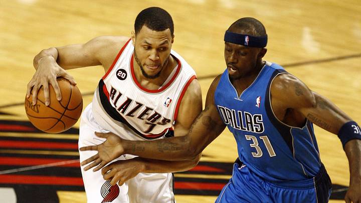 Portland Trail Blazers guard Brandon Roy dribbles against Dallas Mavericks guard Jason Terry in the second quarter of game three of the first round of the 2011 NBA playoffs at the Rose Garden. Mandatory Credit: Joe Nicholson-Imagn Images