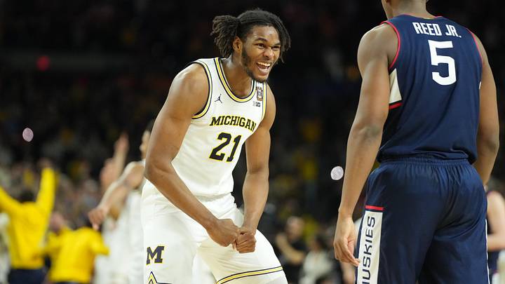 Apr 6, 2026; Indianapolis, IN, USA; Michigan Wolverines forward Morez Johnson Jr. (21) celebrates after defeating the Connecticut Huskies in the national championship of the Final Four of the men's 2026 NCAA Tournament at Lucas Oil Stadium. Mandatory Credit: Robert Deutsch-Imagn Images Apr 6, 2026; Indianapolis, IN, USA; Michigan Wolverines forward Morez Johnson Jr. (21) celebrates after defeating the Connecticut Huskies in the national championship of the Final Four of the men's 2026 NCAA Tournament at Lucas Oil Stadium. Mandatory Credit: Robert Deutsch-Imagn Images