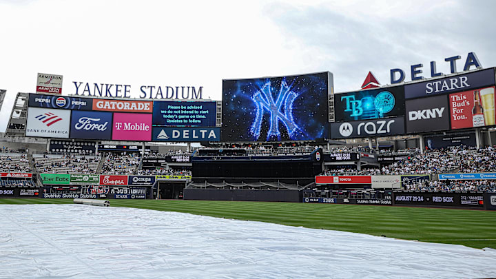 May 4, 2025; Bronx, New York, USA; A rain delay message is displayed on the main scoreboard  before the game against the Tampa Bay Rays at Yankee Stadium. Mandatory Credit: Vincent Carchietta-Imagn Images