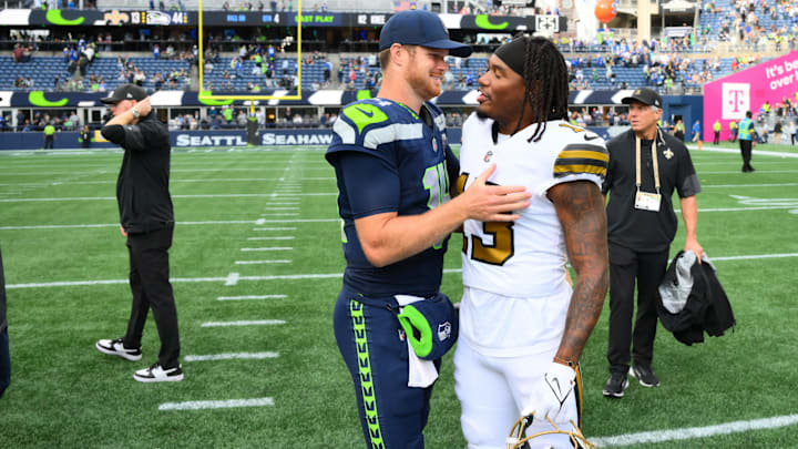 Seattle Seahawks quarterback Sam Darnold (14) and New Orleans Saints running back Velus Jones Jr. (13).