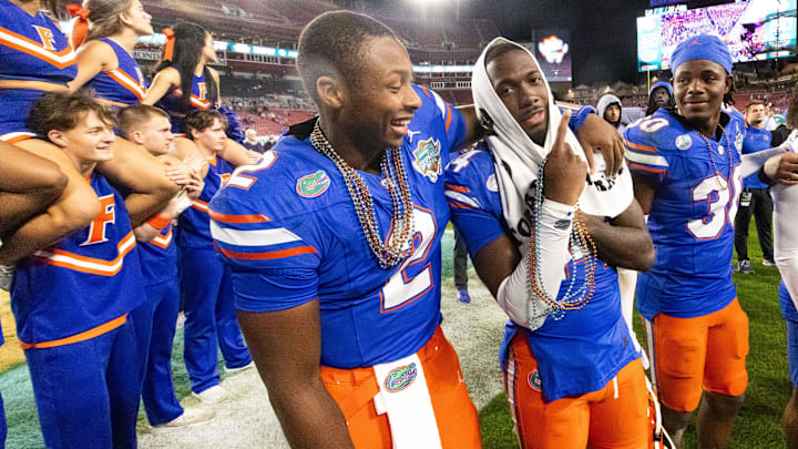 Florida Gators quarterback DJ Lagway (2) celebrates with Florida Gators running back KD Daniels (21) at Raymond James Stadium in Tampa, FL on Friday, December 20, 2024 in the 2024 Union Home Mortgage Gasparilla Bowl. The Gators defeated Tulane 33-8. [Doug Engle/Gainesville Sun]