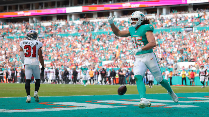 Miami Dolphins tight end Greg Dulcich (85) celebrates after scoring a touchdown during the second quarter against the Tampa Bay Buccaneers at Hard Rock Stadium. 