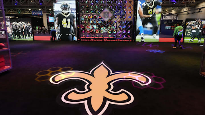 Feb 5, 2025; New Orleans, LA, USA; The New Orleans Saints logo at the Super Bowl LIX Experience at the Ernest N. Morial Convention Center. Mandatory Credit: Kirby Lee-Imagn Images Feb 5, 2025; New Orleans, LA, USA; The New Orleans Saints logo at the Super Bowl LIX Experience at the Ernest N. Morial Convention Center. Mandatory Credit: Kirby Lee-Imagn Images
