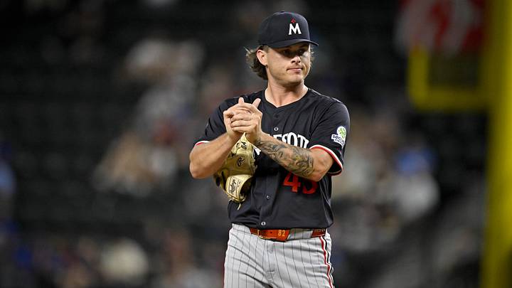 Sep 24, 2025; Arlington, Texas, USA; Minnesota Twins relief pitcher Travis Adams (45) reacts to giving up a run to the Texas Rangers during the seventh inning at Globe Life Field. Mandatory Credit: Jerome Miron-Imagn Images