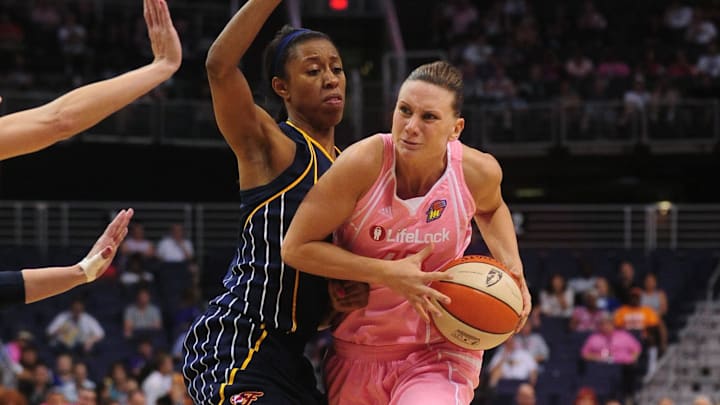 Aug 8, 2010; Phoenix, AZ, USA; Phoenix Mercury forward Penny Taylor drives the ball against Indiana Fever forward Jessica Moore during the second half at US Airways Center.  The Fever defeated the Mercury 104-82.  Mandatory Credit: Jennifer Stewart-Imagn Images