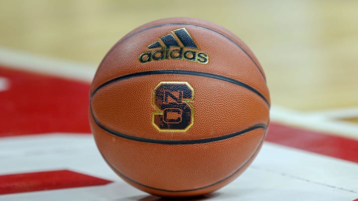 Feb 20, 2019; Raleigh, NC, USA; Basketball with the North Carolina State Wolfpack logo sits on the court during a timeout as the Wolfpack play the Boston College Eagles in the first half at PNC Arena. The North Carolina State Wolfpack won 89-80. Mandatory Credit: Nell Redmond-Imagn Images