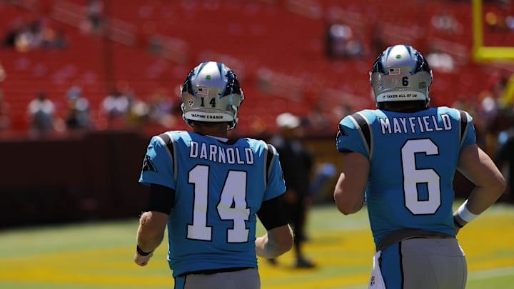 Panthers quarterback Sam Darnold (14) and Baker Mayfield (6) prepared for a preason game in 2022. Panthers quarterback Sam Darnold (14) and Baker Mayfield (6) prepared for a preason game in 2022.