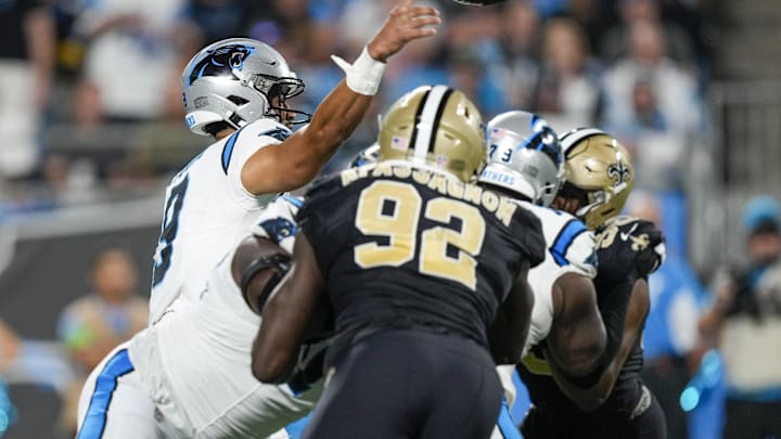 Sep 18, 2023; Charlotte, North Carolina, USA; Carolina Panthers quarterback Bryce Young (9) throws under pressure from New Orleans Saints defensive end Tanoh Kpassagnon (92) during the second half at Bank of America Stadium. Mandatory Credit: Jim Dedmon-USA TODAY Sports Sep 18, 2023; Charlotte, North Carolina, USA; Carolina Panthers quarterback Bryce Young (9) throws under pressure from New Orleans Saints defensive end Tanoh Kpassagnon (92) during the second half at Bank of America Stadium. Mandatory Credit: Jim Dedmon-USA TODAY Sports