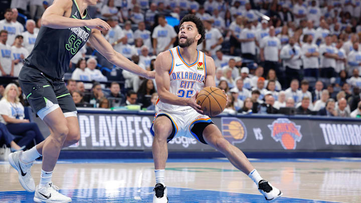 May 20, 2025; Oklahoma City, Oklahoma, USA; Oklahoma City Thunder guard Ajay Mitchell (25) drives to the basket against Minnesota Timberwolves center Luka Garza (55) in the fourth quarter during game one of the western conference finals for the 2025 NBA Playoffs at Paycom Center. Mandatory Credit: Alonzo Adams-Imagn Images May 20, 2025; Oklahoma City, Oklahoma, USA; Oklahoma City Thunder guard Ajay Mitchell (25) drives to the basket against Minnesota Timberwolves center Luka Garza (55) in the fourth quarter during game one of the western conference finals for the 2025 NBA Playoffs at Paycom Center. Mandatory Credit: Alonzo Adams-Imagn Images