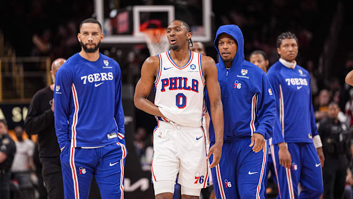 Mar 7, 2026; Atlanta, Georgia, USA; Philadelphia 76ers guard Tyrese Maxey (0) reacts and is assisted after being injured against the Atlanta Hawks during the second half at State Farm Arena. Mandatory Credit: Dale Zanine-Imagn Images