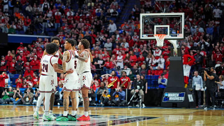 Mar 20, 2025; Lexington, KY, USA; The Louisville Cardinals huddle on the court during the second half against the Creighton Bluejays in the first round of the NCAA Tournament at Rupp Arena. Mandatory Credit: Aaron Doster-Imagn Images