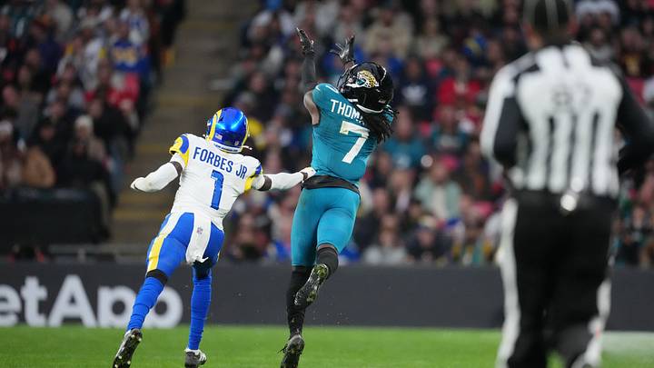 Oct 19, 2025; London, United Kingdom; Jacksonville Jaguars wide receiver Brian Thomas Jr. (7) reaches for the ball against Los Angeles Rams cornerback Emmanuel Forbes Jr. (1) during the second half of an NFL International Series game at Wembley Stadium. Mandatory Credit: Kirby Lee-Imagn Images Oct 19, 2025; London, United Kingdom; Jacksonville Jaguars wide receiver Brian Thomas Jr. (7) reaches for the ball against Los Angeles Rams cornerback Emmanuel Forbes Jr. (1) during the second half of an NFL International Series game at Wembley Stadium. Mandatory Credit: Kirby Lee-Imagn Images