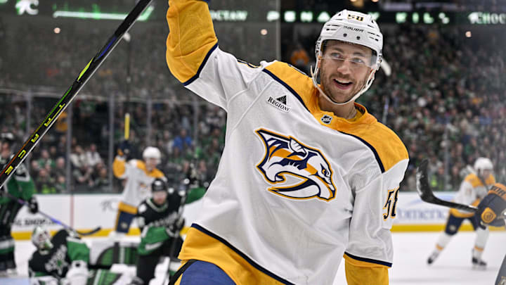 Feb 28, 2026; Dallas, Texas, USA; Nashville Predators left wing Michael Bunting (58) celebrates scoring a power play goal against Dallas Stars goaltender Jake Oettinger (29) during the first period at the American Airlines Center. Mandatory Credit: Jerome Miron-Imagn Images