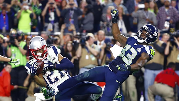 New England Patriots strong safety Malcolm Butler (21) intercepts a pass intended for Seattle Seahawks wide receiver Ricardo Lockette (83) in the fourth quarter in Super Bowl XLIX at University of Phoenix Stadium in 2015.