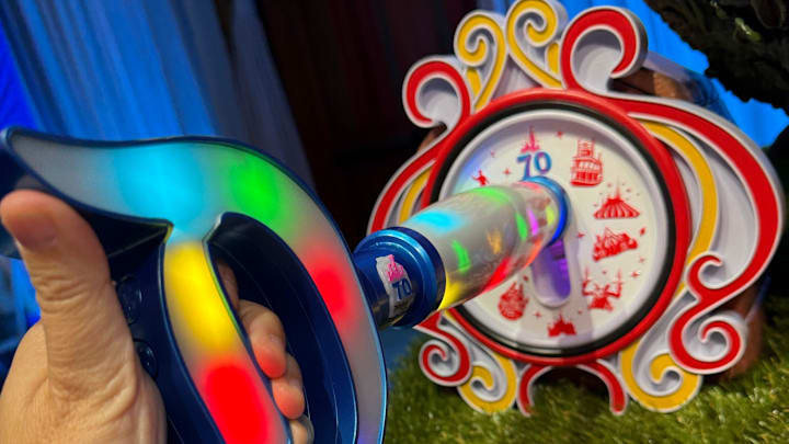 The new Key to Disneyland unlocks interactive effects in each of Disneyland's nine lands, during its 70th anniversary celebration. Once guests visit them all, the back of the key reveals a mystery pin.