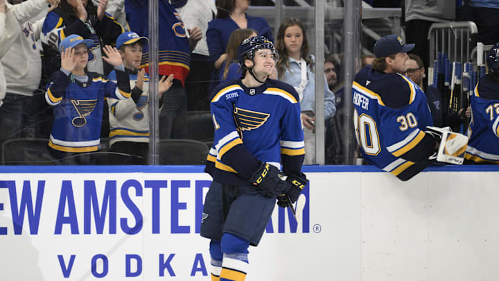 Apr 15, 2025; St. Louis, Missouri, USA; St. Louis Blues right wing Jimmy Snuggerud (21) reacts after scoring his first NHL goal against the Utah Hockey Club during the first period at Enterprise Center. Mandatory Credit: Jeff Le-Imagn Images Apr 15, 2025; St. Louis, Missouri, USA; St. Louis Blues right wing Jimmy Snuggerud (21) reacts after scoring his first NHL goal against the Utah Hockey Club during the first period at Enterprise Center. Mandatory Credit: Jeff Le-Imagn Images