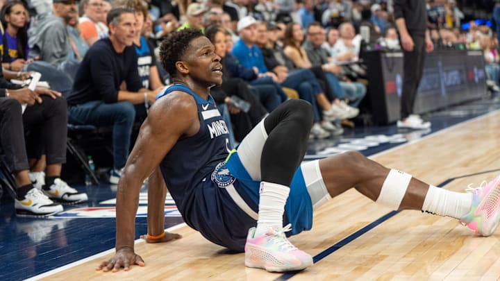 Apr 27, 2025; Minneapolis, Minnesota, USA; Minnesota Timberwolves guard Anthony Edwards (5) falls down after a collision with a Los Angeles Lakers player in the third quarter during game four of first round for the 2025 NBA Playoffs at Target Center. Mandatory Credit: Matt Blewett-Imagn Images