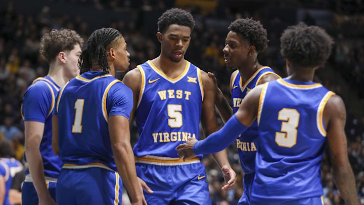 Jan 31, 2026; Morgantown, West Virginia, USA; West Virginia Mountaineers forward DJ Thomas (5) celebrates with teammates during the first half against the Baylor Bears at Hope Coliseum. Mandatory Credit: Ben Queen-Imagn Images Jan 31, 2026; Morgantown, West Virginia, USA; West Virginia Mountaineers forward DJ Thomas (5) celebrates with teammates during the first half against the Baylor Bears at Hope Coliseum. Mandatory Credit: Ben Queen-Imagn Images