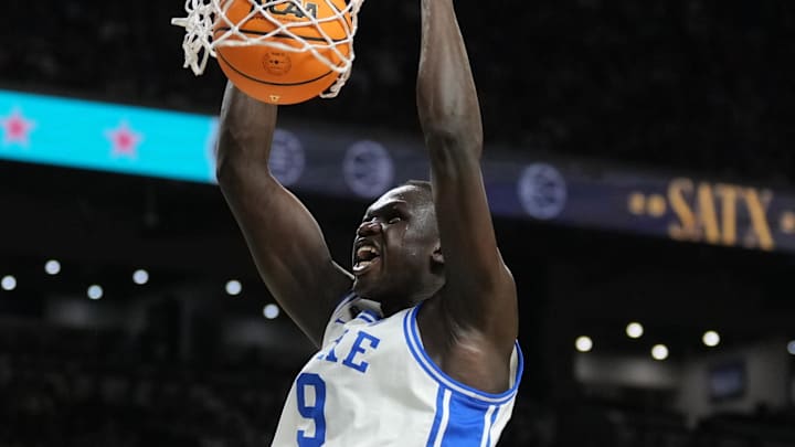 Apr 5, 2025; San Antonio, TX, USA; Duke Blue Devils center Khaman Maluach (9) dunks against the Houston Cougars= in the semifinals of the men's Final Four of the 2025 NCAA Tournament at the Alamodome. Mandatory Credit: Robert Deutsch-Imagn Images