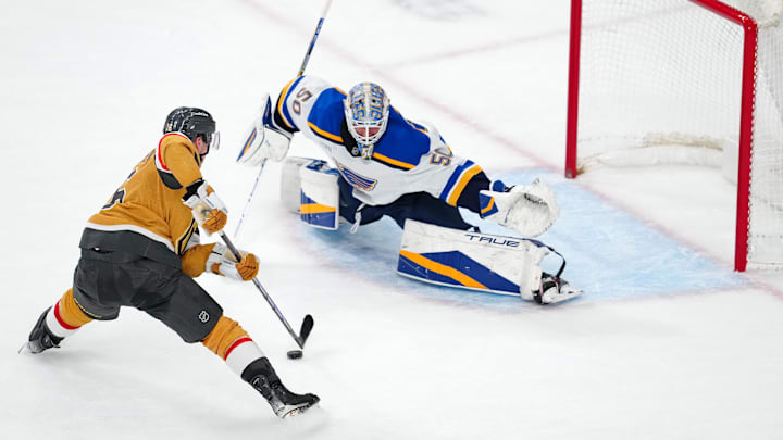 Jan 20, 2025; Las Vegas, Nevada, USA; Vegas Golden Knights left wing Pavel Dorofeyev (16) looks to shoot against St. Louis Blues goaltender Jordan Binnington (50) during a shoot out at T-Mobile Arena. Mandatory Credit: Stephen R. Sylvanie-Imagn Images