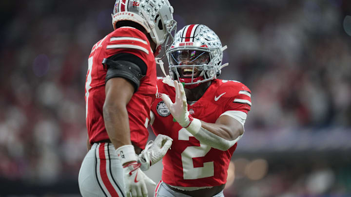 Ohio State Buckeyes defensive backs Caleb Downs and Lorenzo Styles Jr. against the Indiana Hoosiers during the 2025 Big Ten championship 