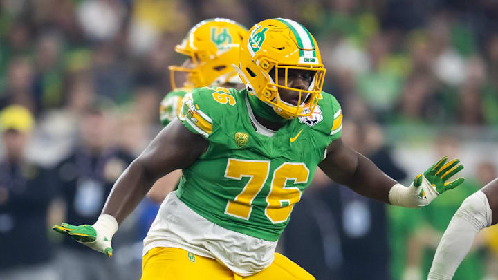 Jan 1, 2024; Glendale, AZ, USA; Oregon Ducks offensive lineman Josh Conerly Jr. (76) against the Liberty Flames during the 2024 Fiesta Bowl at State Farm Stadium. Mandatory Credit: Mark J. Rebilas-Imagn Images
