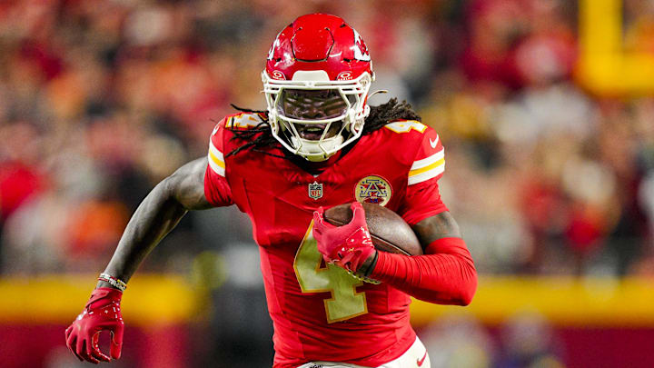Oct 27, 2025; Kansas City, Missouri, USA; Kansas City Chiefs wide receiver Rashee Rice (4) runs with the ball during the second half against the Washington Commanders at GEHA Field at Arrowhead Stadium. 