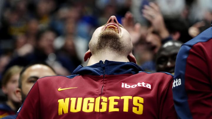 Mar 15, 2025; Denver, Colorado, USA; Denver Nuggets center Nikola Jokic (15) reacts from the bench in the second quarter against the Washington Wizards at Ball Arena. Mandatory Credit: Ron Chenoy-Imagn Images