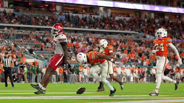 Oct 17, 2025; Miami Gardens, Florida, USA; Louisville Cardinals wide receiver Chris Bell (0) scores a touchdown against the Miami Hurricanes during the fourth quarter at Hard Rock Stadium. Mandatory Credit: Sam Navarro-Imagn Images Oct 17, 2025; Miami Gardens, Florida, USA; Louisville Cardinals wide receiver Chris Bell (0) scores a touchdown against the Miami Hurricanes during the fourth quarter at Hard Rock Stadium. Mandatory Credit: Sam Navarro-Imagn Images