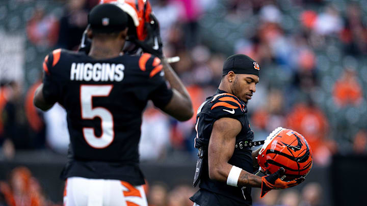 Cincinnati Bengals wide receiver Ja'Marr Chase (1) and Cincinnati Bengals wide receiver Tee Higgins (5) prepare to warm up before the NFL game between the Cincinnati Bengals and the Denver Broncos at Paycor Stadium in Cincinnati on Saturday, Dec. 28, 2024.