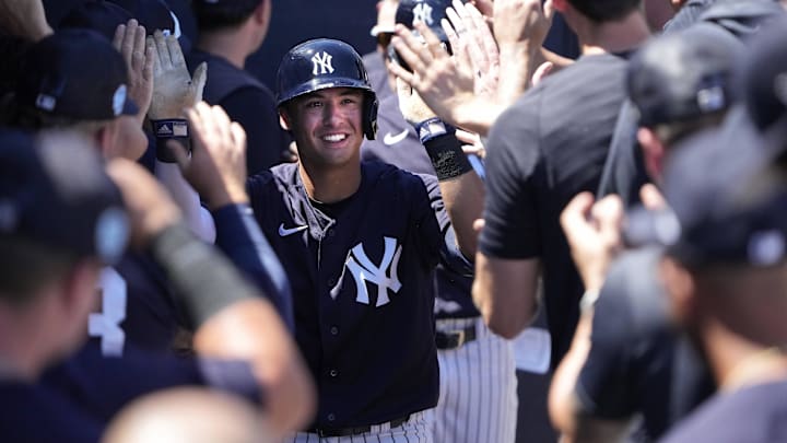 Mar 24, 2023; Tampa, Florida, USA; New York Yankees shortstop Anthony Volpe (77) is congratulated in