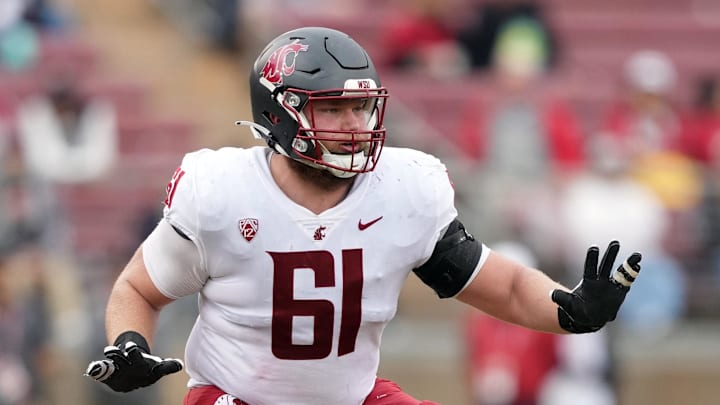 Nov 5, 2022; Stanford, California, USA; Washington State Cougars offensive lineman Christian Hilborn (61) blocks against the Stanford Cardinal during the second quarter at Stanford Stadium. Mandatory Credit: Darren Yamashita-Imagn Images