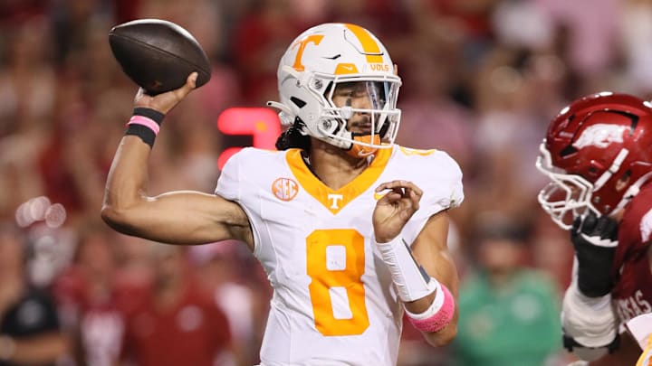 Tennessee Volunteers quarterback Nico Iamaleava (8) passes in the second quarter against the Arkansas Razorbacks at Donald W. Reynolds Razorback Stadium. Tennessee Volunteers quarterback Nico Iamaleava (8) passes in the second quarter against the Arkansas Razorbacks at Donald W. Reynolds Razorback Stadium.