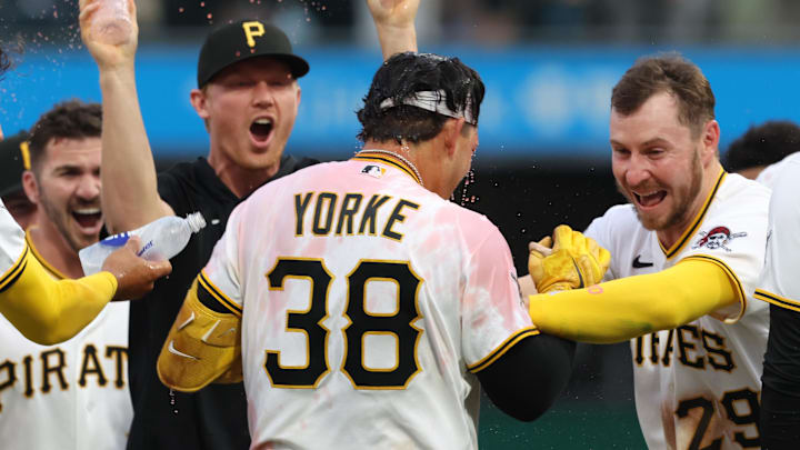 Apr 4, 2026; Pittsburgh, Pennsylvania, USA;  Pittsburgh Pirates designated hitter Nick Yorke (38) and celebrates with Pittsburgh Pirates pitcher Mitch Keller (left) and right fielder Ryan O'Hearn (29) after Yorke hit  a game winning walk-off single to defeat the Baltimore Orioles in the ninth inning at PNC Park. Mandatory Credit: Charles LeClaire-Imagn Images