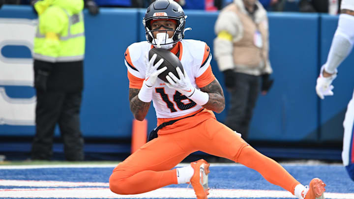 Jan 12, 2025; Orchard Park, New York, USA; Denver Broncos wide receiver Troy Franklin (16) catches a touchdown pass against the Buffalo Bills during the first quarter in an AFC wild card game at Highmark Stadium. Mandatory Credit: Mark Konezny-Imagn Images