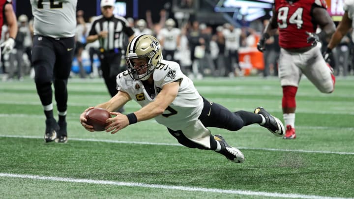 Sep 23, 2018; Atlanta, GA, USA; New Orleans Saints quarterback Drew Brees (9) dives for a rushing touchdown in the fourth quarter against the Atlanta Falcons at Mercedes-Benz Stadium. Mandatory Credit: Jason Getz-USA TODAY Sports Sep 23, 2018; Atlanta, GA, USA; New Orleans Saints quarterback Drew Brees (9) dives for a rushing touchdown in the fourth quarter against the Atlanta Falcons at Mercedes-Benz Stadium. Mandatory Credit: Jason Getz-USA TODAY Sports
