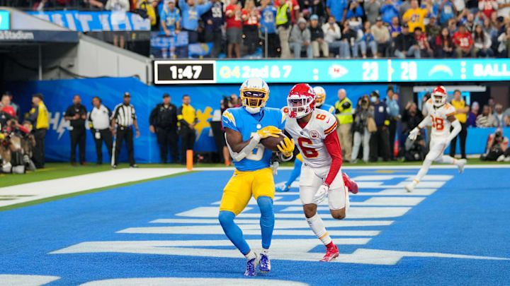 Nov 20, 2022; Inglewood, California, USA; Los Angeles Chargers wide receiver Joshua Palmer (5) scores a touchdown past Kansas City Chiefs safety Bryan Cook (6) in then fourth at SoFi Stadium. 