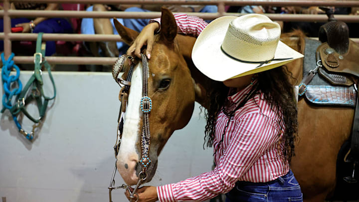 Linda Brown of Oklahoma City tends to her horse at the Jacksonville Equestrian Center Saturday, June 7, 2025 in Jacksonville, Fla. Black Rodeo USA came back for the 3rd annual show, putting on two perfomances that showcased calf roping, bronc riding, steer wrestling, ladies steer undecorating, barrel racing, relays, and bull riding. Two shows were held at 1 p.m. and 7 p.m., promoting an appreciation for African American cultural, and how a rich heritage helped shape the West.