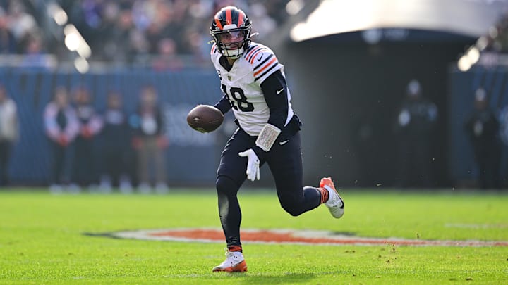 Nov 24, 2024; Chicago, Illinois, USA; Chicago Bears quarterback Caleb Williams (18) runs the ball against the Minnesota Vikings during the second quarter at Soldier Field. Mandatory Credit: Daniel Bartel-Imagn Images